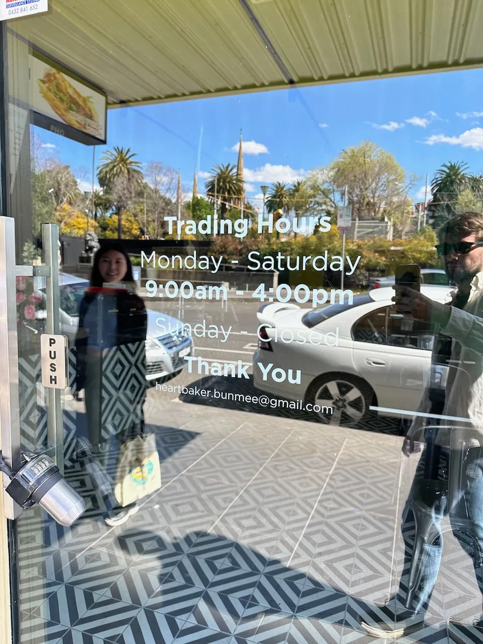 An example of "trading hours" listed on a banh mi shop